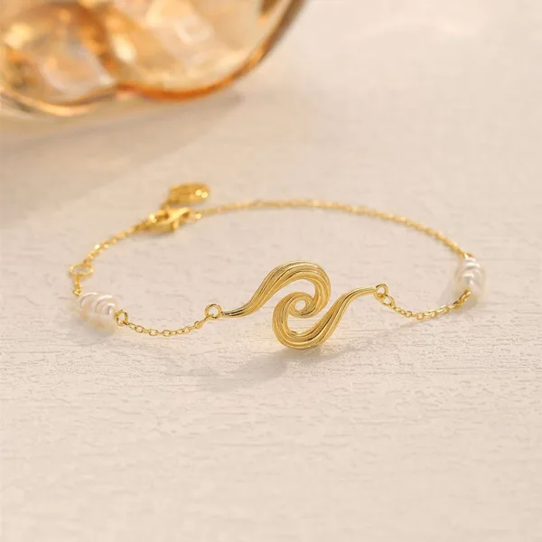 Waves armbånd forgyldt i forgyldt sølv fra Spinning Jewelry